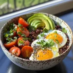 A side view of a hearty protein breakfast bowl showcasing vibrant layers of ingredients.