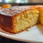A delicious slice of Almond Orange Olive Oil Cake, emphasizing its nutty texture and citrus aroma.