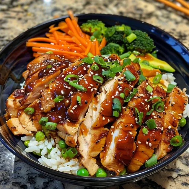 Elevate Your Weeknight Dinners with a Flavor-Packed Teriyaki Chicken Bowl Close-up view of a vibrant Teriyaki Chicken Bowl with colorful vegetables.