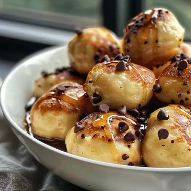 Juicy pancake bites arranged on a plate, showcasing their fluffy texture.