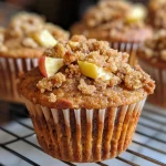 Close-up view of delicious Apple Cinnamon Muffins with a golden-brown top.