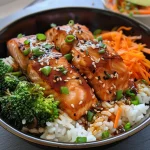 Detailed shot of a Teriyaki Salmon Rice Bowl showcasing juicy salmon, rice, and fresh veggies.