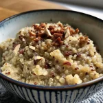 ['Close-up side view of a bowl filled with vibrant Breakfast Quinoa topped with raisins and coconut.', 'A detailed shot of a creamy Breakfast Quinoa dish featuring scattered chocolate chips and a sprinkle of cinnamon.', 'An inviting side view of Breakfast Quinoa in a bowl, showcasing its rich texture and toppings.', 'A visually appealing close-up of Breakfast Quinoa, highlighting its colorful ingredients and creamy consistency.']
