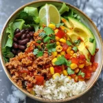 ['Close-up view of a colorful Healthy Turkey Taco Bowl with fresh ingredients.', 'A vibrant Turkey Taco Bowl featuring ground turkey, rice, and fresh veggies.', 'Side view of a Healthy Turkey Taco Bowl showcasing toppings like avocado, corn, and salsa.', 'Detailed shot of a Healthy Turkey Taco Bowl filled with lean turkey and colorful toppings.']