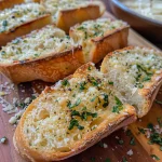 ['Close-up view of golden-brown air fryer garlic bread slices topped with melted cheese and herbs.', 'Side view of air fryer garlic bread showcasing crispy edges and a buttery garlic spread.', 'Juicy, toasted garlic bread slices fresh from the air fryer, garnished with parsley and parmesan.', 'Air fryer garlic bread displayed on a plate, revealing a rich garlic topping and herb decoration.']