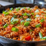 ['A close-up side view of a bowl filled with colorful Easy Taco Rice, topped with sliced green onions.', 'Juicy Easy Taco Rice in a bowl, featuring ingredients like rice, chopped onions, and spices, captured from the side.', 'A detailed view of Easy Taco Rice served in a bowl, with vibrant green onions sprinkled on top.', 'Side perspective of a hearty serving of Easy Taco Rice, showcasing its texture and ingredients.']