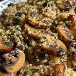 ['Close-up view of a bowl of Garlicky Mushroom Quinoa with mushrooms and quinoa visibly mixed.', 'Side view of a delicious serving of Garlicky Mushroom Quinoa, highlighting mushrooms and garnishes.', 'A rich, textured dish of Garlicky Mushroom Quinoa, showcasing the vibrant mushrooms and grains.', 'Detailed image of Garlicky Mushroom Quinoa, featuring sliced cremini mushrooms and cooked quinoa.']