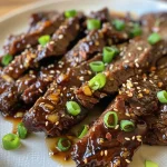 ['Close-up of juicy sticky honey garlic beef garnished with green onions and sesame seeds.', 'Side view of tender flank steak glazed with a honey garlic sauce, topped with sliced green onions.', 'Detailed image of sticky honey garlic beef, showcasing a shiny, caramelized surface and sesame seeds.', 'Succulent pieces of beef in a rich honey garlic sauce with fresh green onions scattered on top.']