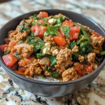 ['Close-up of a creamy ground turkey and spinach protein bowl with vibrant green spinach and a rich sauce.', 'Side view of a delicious protein bowl filled with ground turkey, creamy cottage cheese, and fresh spinach.', 'Juicy protein bowl featuring ground turkey and spinach, garnished with spices and a creamy texture.', 'Colorful dish showcasing a creamy mixture of ground turkey, spinach, and cottage cheese with seasonings.']