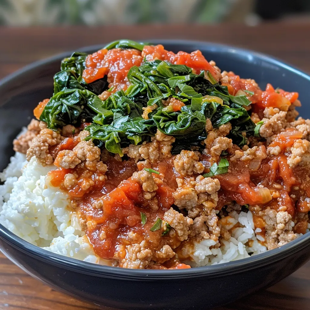 ['Close-up of a creamy ground turkey and spinach protein bowl with vibrant green spinach and a rich sauce.', 'Side view of a delicious protein bowl filled with ground turkey, creamy cottage cheese, and fresh spinach.', 'Juicy protein bowl featuring ground turkey and spinach, garnished with spices and a creamy texture.', 'Colorful dish showcasing a creamy mixture of ground turkey, spinach, and cottage cheese with seasonings.']