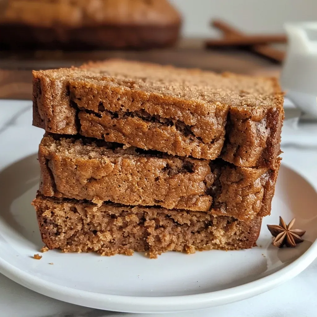 Side angle of freshly baked Chai Latte Pumpkin Spice Bread, showcasing its moist texture.