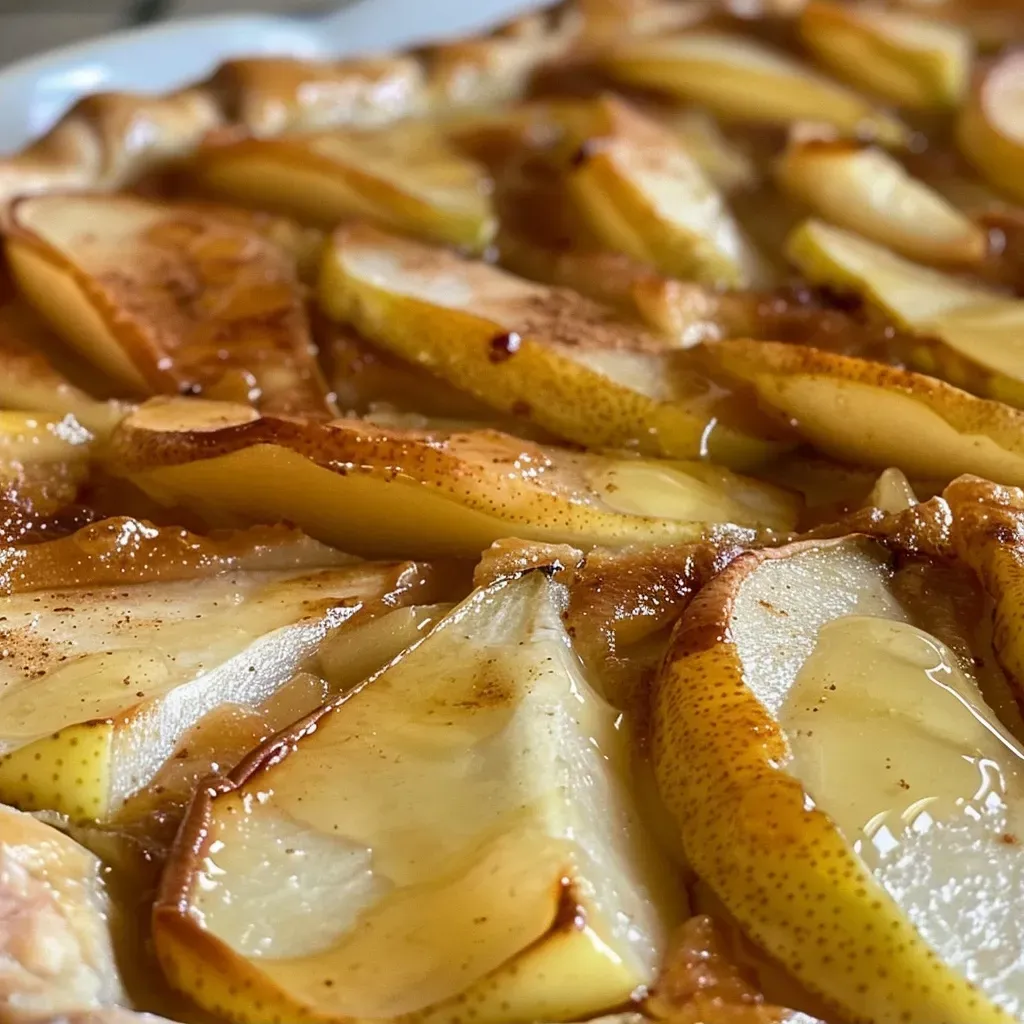 Juicy pear galette displaying flaky crust and caramelized fruit, taken with an iPhone 15 Pro.