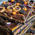 Close-up view of Healthy Halloween Bark with chocolate, pretzels, and candy eyeballs.