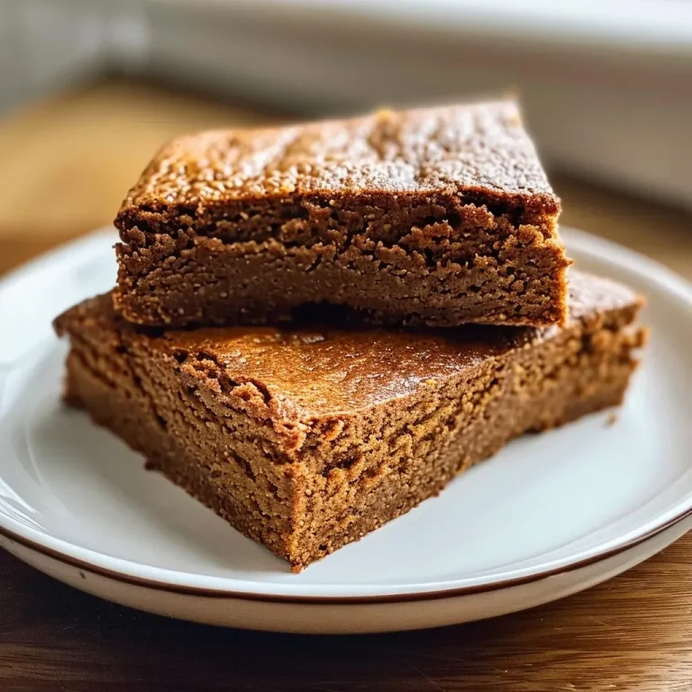 Close-up side view of a healthy gingerbread cake showcasing its moist texture.