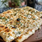 Close-up view of a low carb high protein flatbread on a plate.